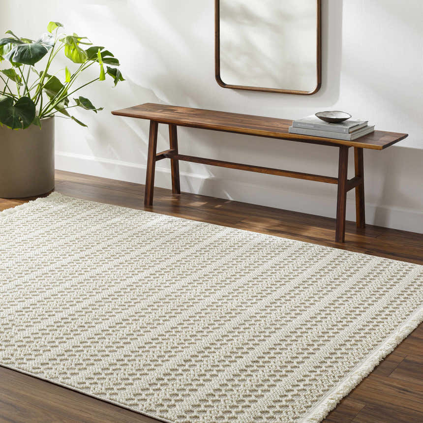 Entryway with a light gray Hamal Area Rug, wood bench, mirror, and monstera plant. Roomscene-Rectangle