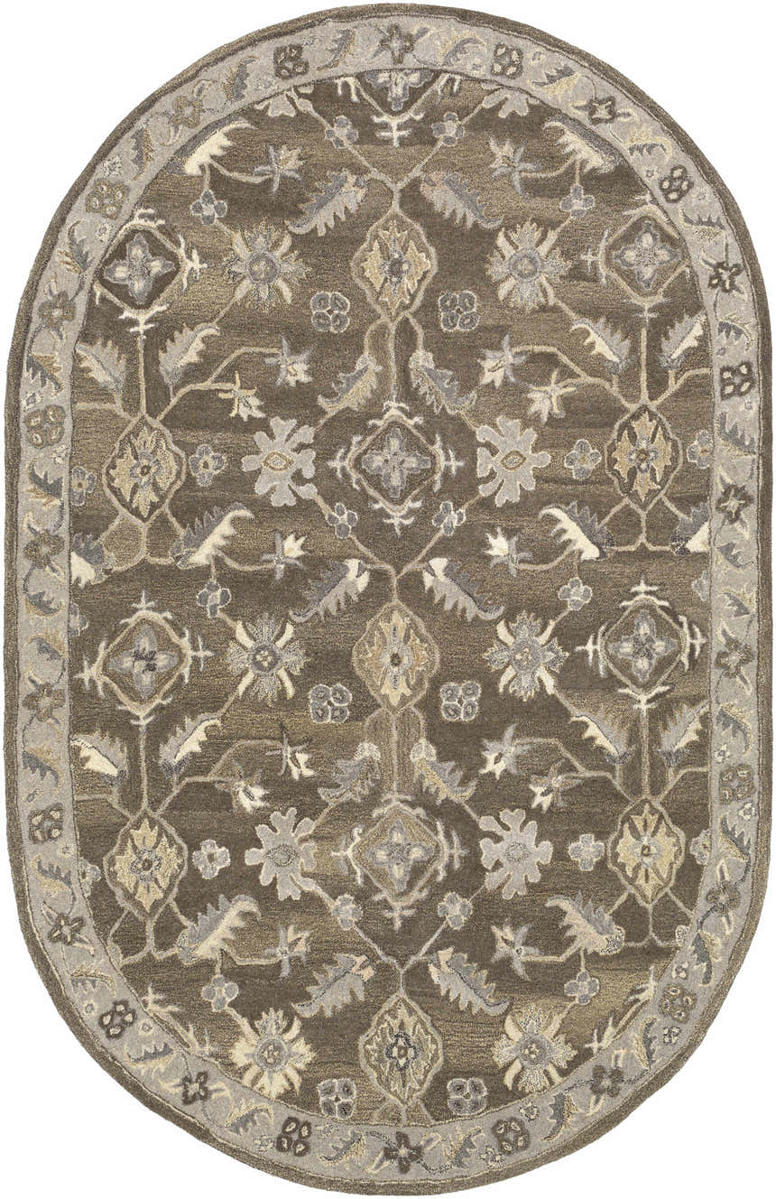 Close-up of the oval Solen Area Rug. Brown wool rug with a traditional floral and geometric pattern in beige, taupe, and gray. Design-Oval-69