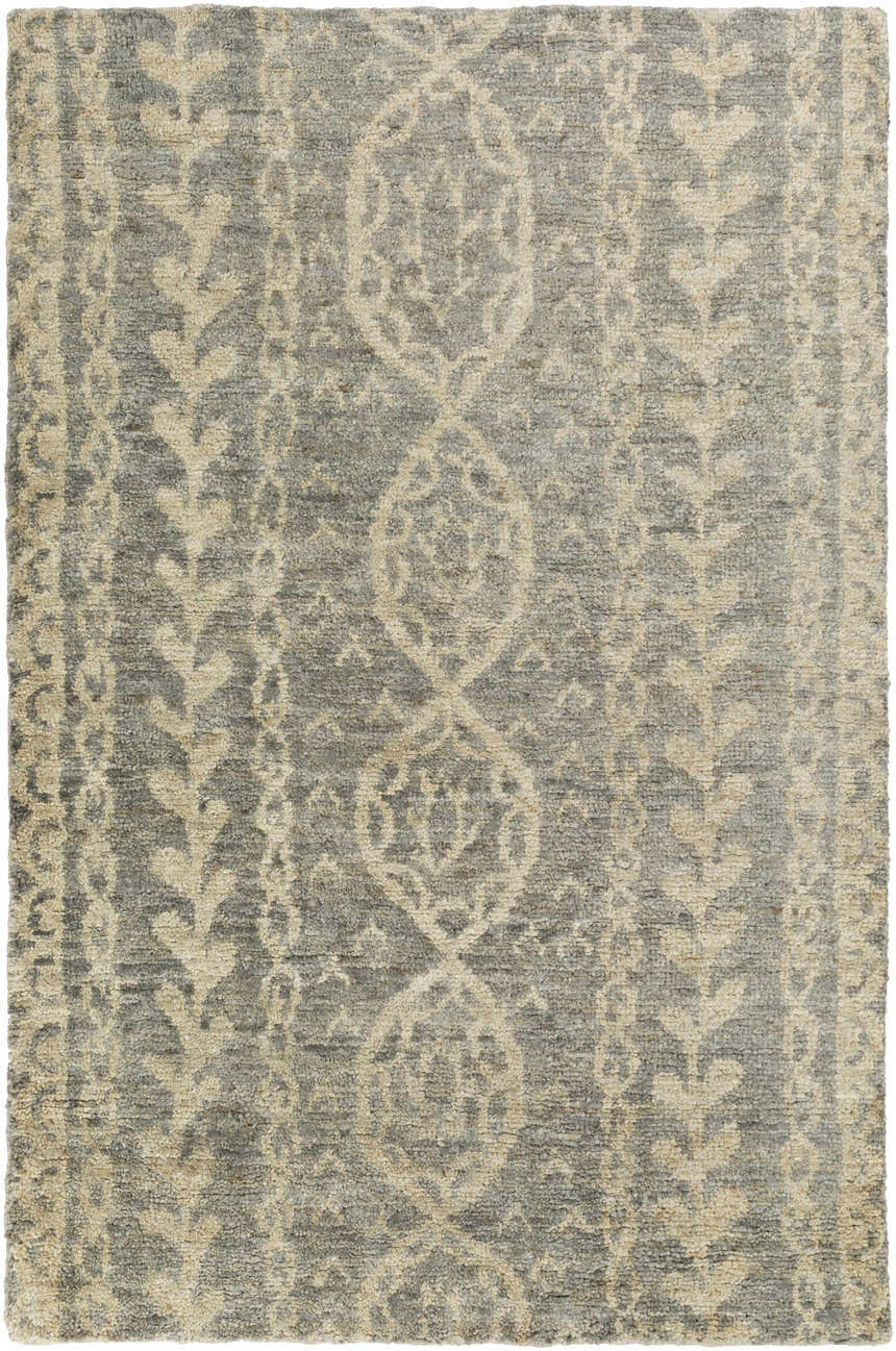 Close-up of the Sonnette Jute Rug. Hand-knotted rug in brown, gray, and ivory with a farmhouse-style geometric pattern. Design-Rectangle-811
