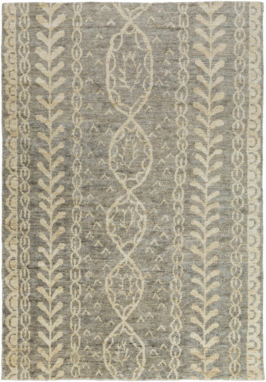 Close-up of the Sonnette Jute Rug. Hand-knotted rug in brown, gray, and ivory with farmhouse style leaf and chain pattern. Design-Rectangle-811