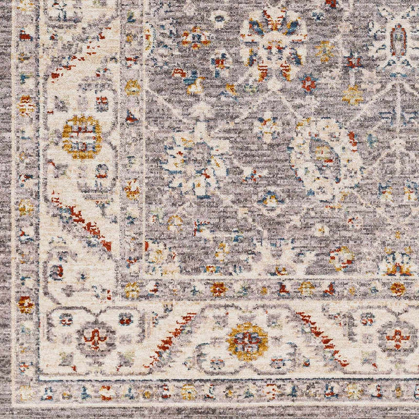Close-up of the Sosi Area Carpet. Machine-woven traditional design in dark beige, garnet, gray, and taupe. Floral pattern. Swatch