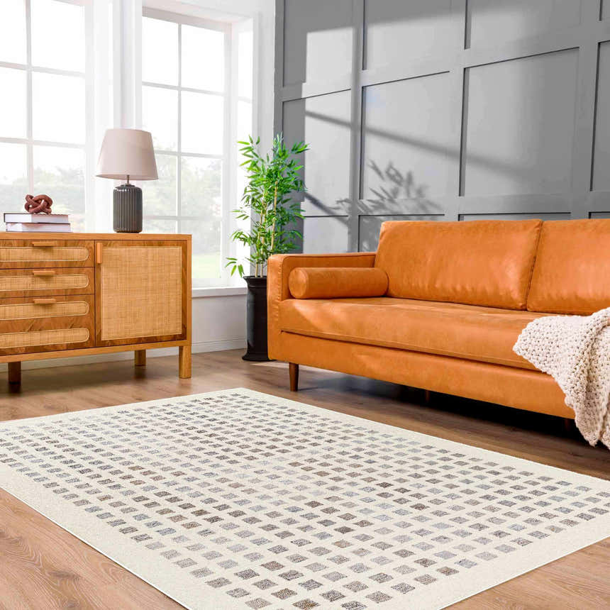 Living room with orange sofa and beige Harib Area Rug with geometric diamond pattern. Roomscene-Rectangle