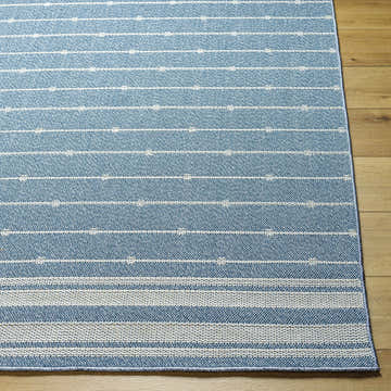 Close-up of Palma Slate Area Rug showing slate blue color and farmhouse-style horizontal stripe pattern. Front