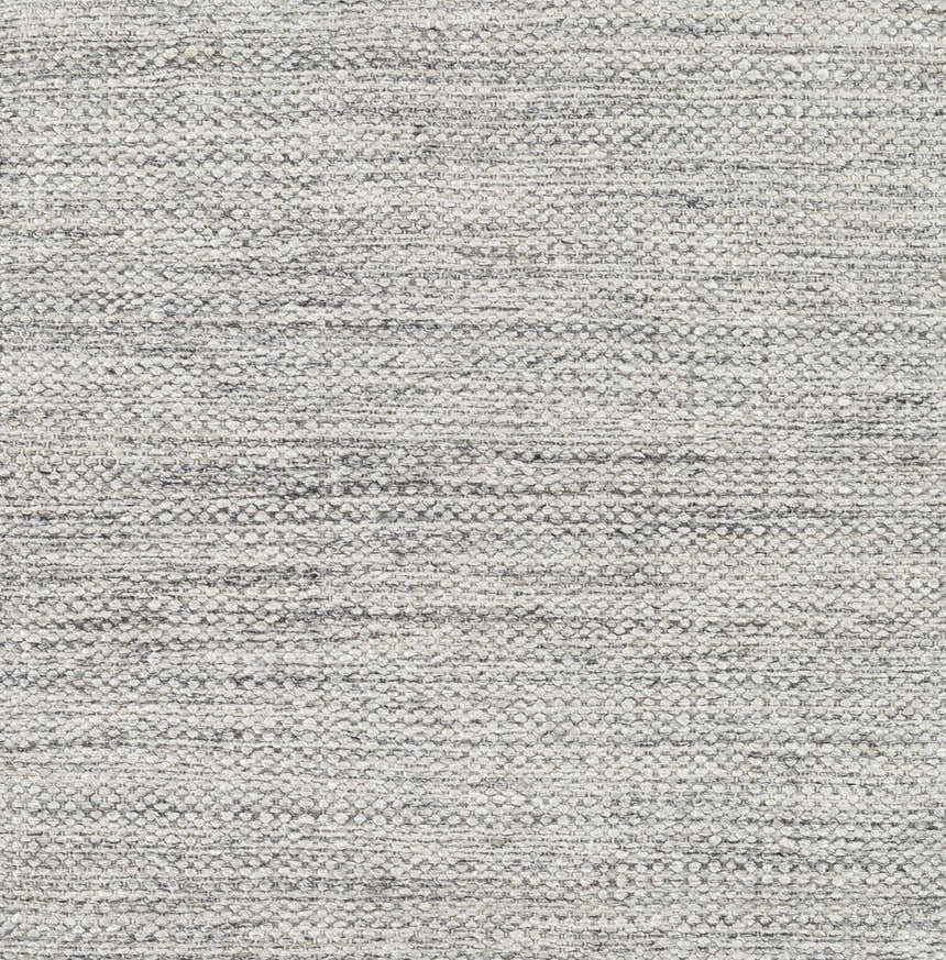 Close-up of the hand woven Spragueville Area Rug. Black and white fibers create a textured, natural look. Texture