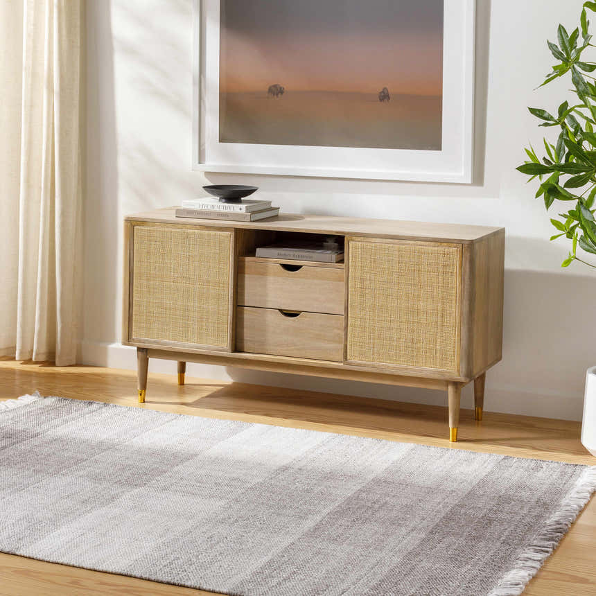 Living room scene with a gray striped Fiora Area Rug, light wood console table, and neutral decor. Roomscene-Rectangle