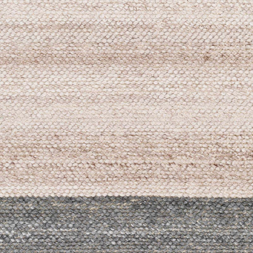 Close-up of the hand woven Edwin Area Rug; lambswool, light brown and dark gray recycled PET yarn texture. Swatch
