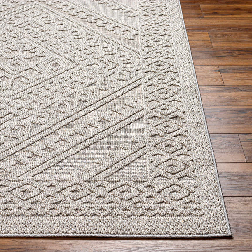 Close up of the Hibah Natural Gray Area Rug showing the contemporary geometric pattern and textured weave. Front
