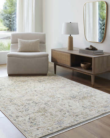 Living room scene with a Margo area rug in dusty sage and gray, beige chair, and mid-century modern console table. Roomscene-Rectangle