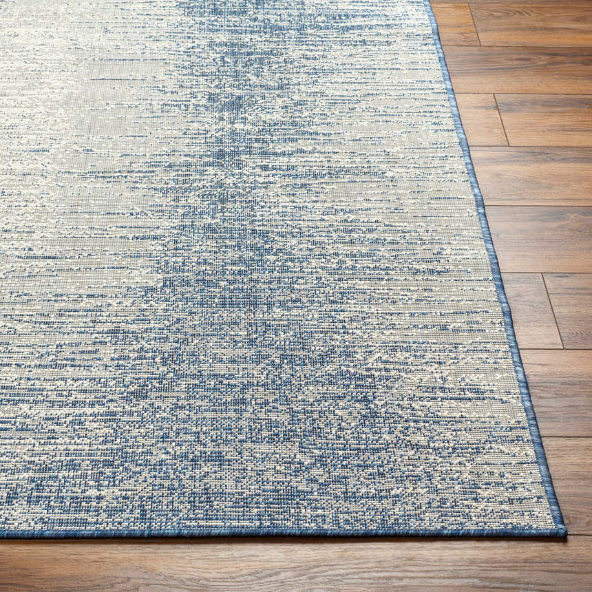 Close-up of the Medi Silver Blue Area Rug showing its textured, contemporary design and blue and beige colors. Front