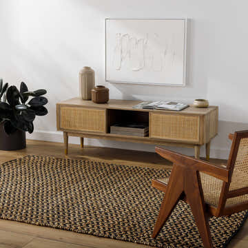 Living room scene with a chocolate brown Genna Area Rug, wood media console, and mid-century modern chair. Roomscene-Rectangle