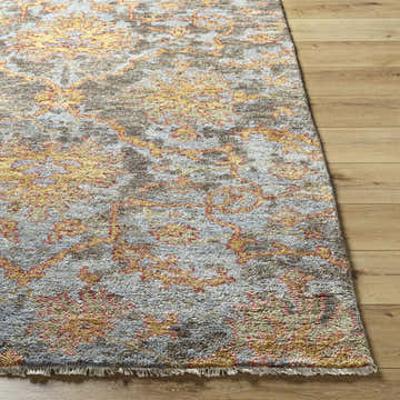 Close-up of the hand-knotted Elena Area Rug. Traditional floral pattern in brick red, mustard, olive, and slate blue wool. Front