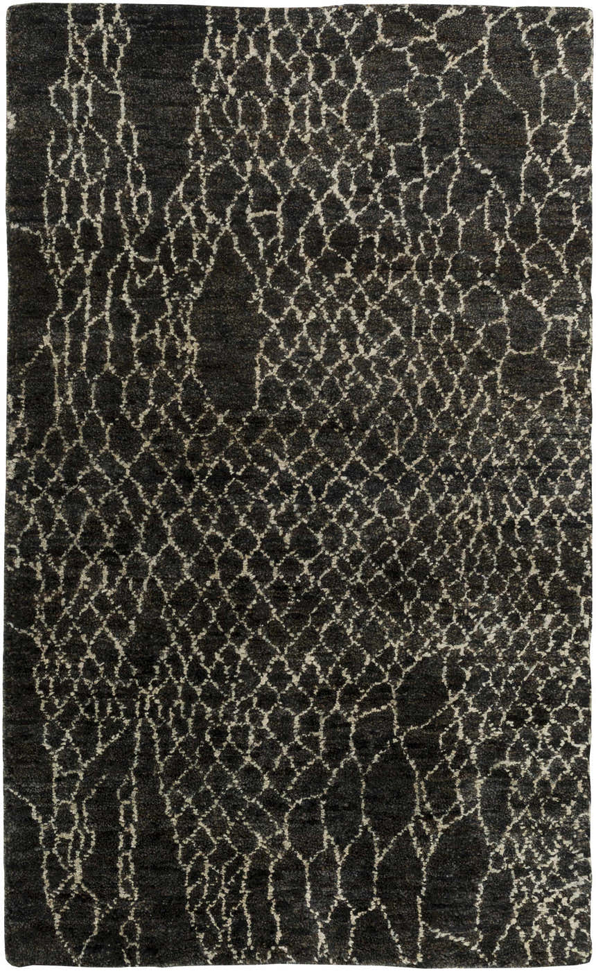 Close-up of the Stephentown Clearance Jute Rug, featuring a dark gray background and a cream-colored geometric pattern. Design-Rectangle-58