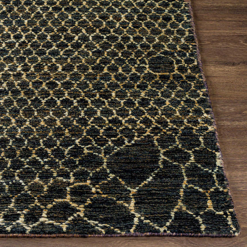 Close-up of the Stephentown Clearance Jute Rug. Hand-knotted rug with a contemporary geometric pattern in dark and beige tones. Front