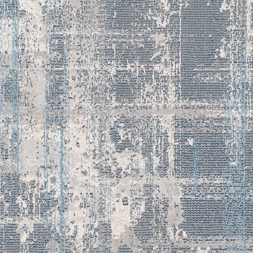 Close-up of the Stokenchurch Area Carpet. Contemporary design in shades of blue, gray, and white with a distressed pattern. Swatch