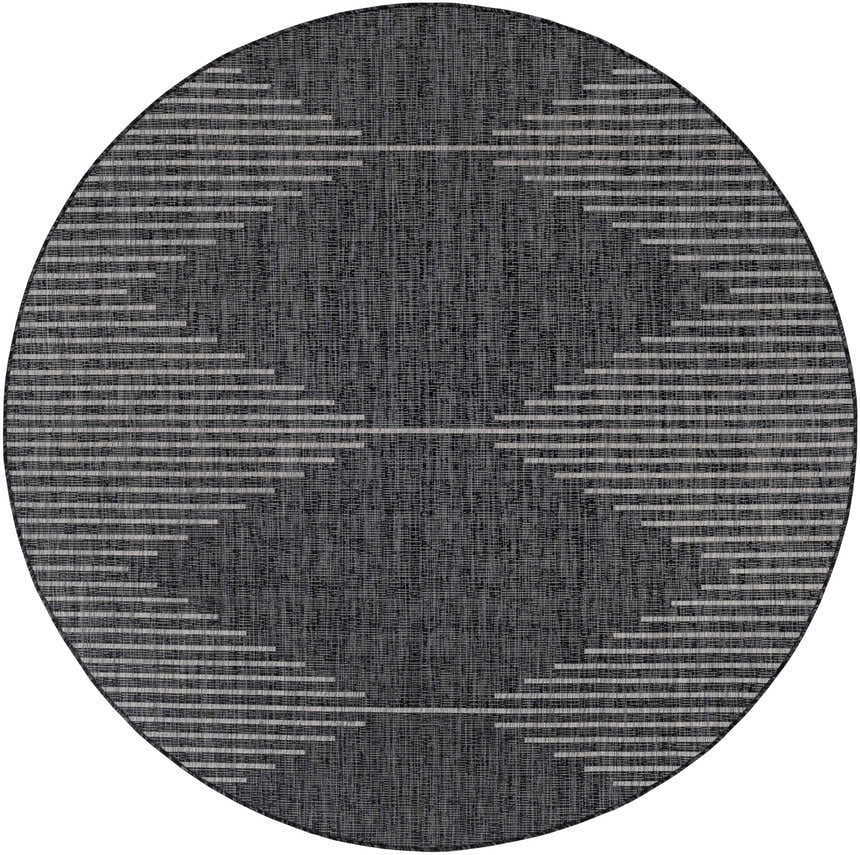 Close-up of round Stephan Area Rug with a black and cream Southwestern-inspired geometric pattern. Design-Round-710