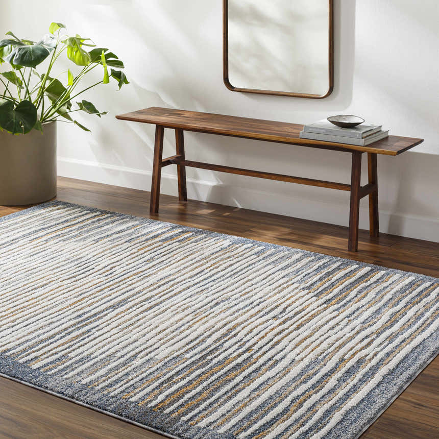 Entryway with Kylar Area Rug in gray, smoke, and gold. Bench with mirror and plant complete the contemporary look. Roomscene-Rectangle