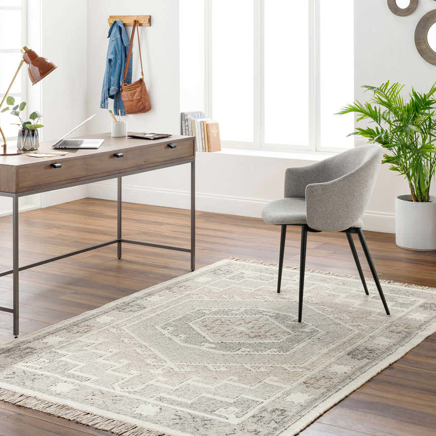 Home office with wood desk, gray chair, and beige Donny Area Rug with traditional pattern. Roomscene-Rectangle