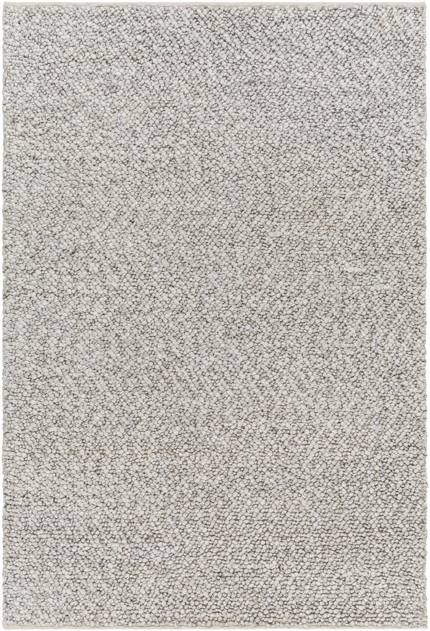 Close-up of the hand woven Chole Area Rug showing texture and neutral gray color variations. Design-Rectangle-576