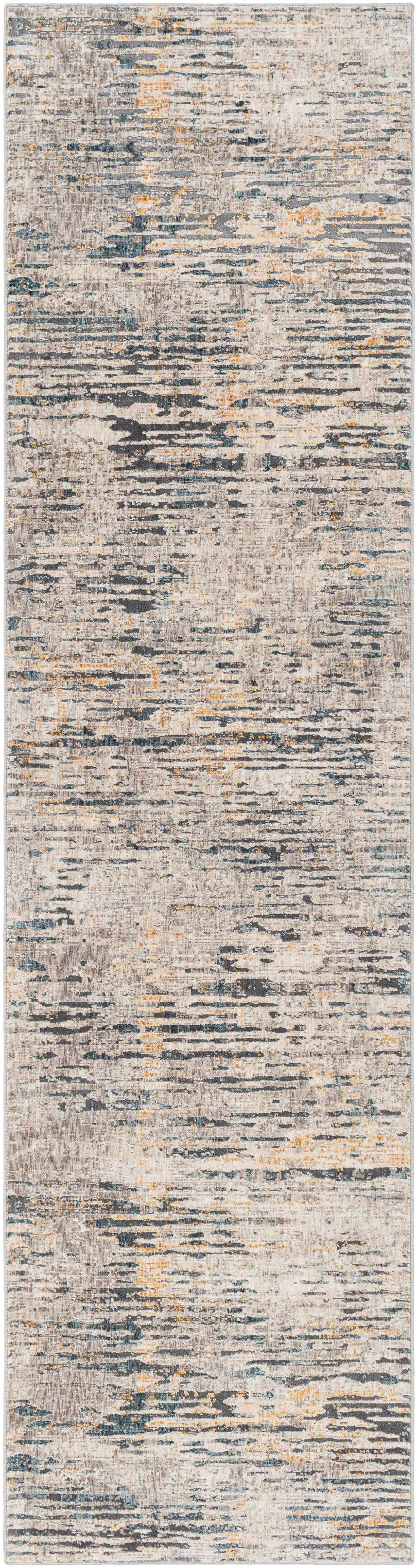 Close-up of the Sywell Luxe Fringe Rug. Beige rug with blue, charcoal and tan horizontal striations. Contemporary style. Design-Runner-2710