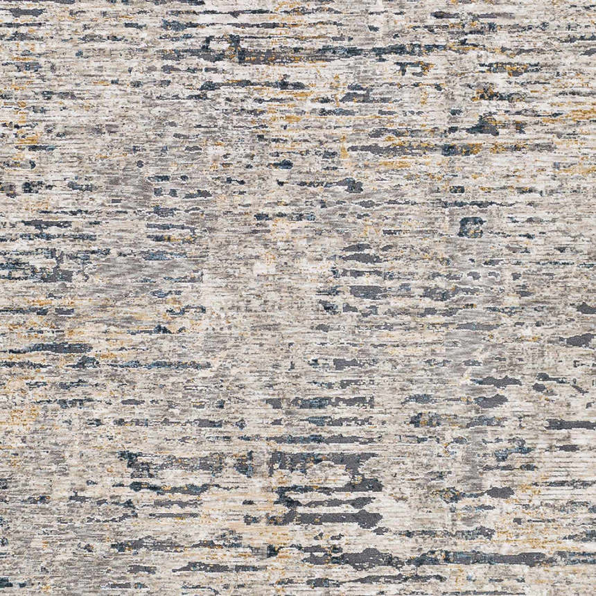 Close-up of the Sywell Luxe Fringe Rug. Beige, blue, charcoal, and tan abstract pattern. Machine woven polyester rug. Swatch