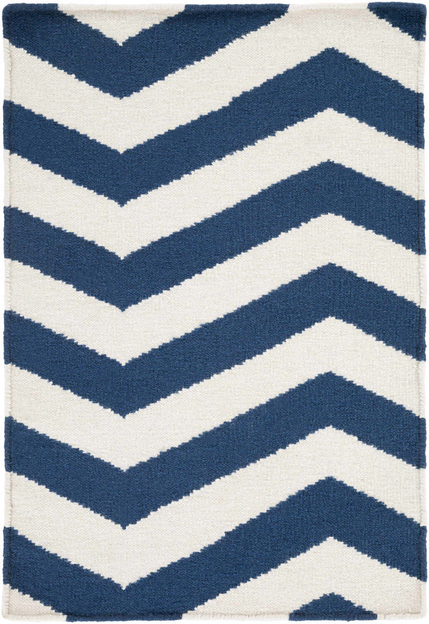 Close-up of the hand woven Tamaya Area Rug. Dark blue and white chevron pattern. 100% wool texture. Design-Rectangle-23