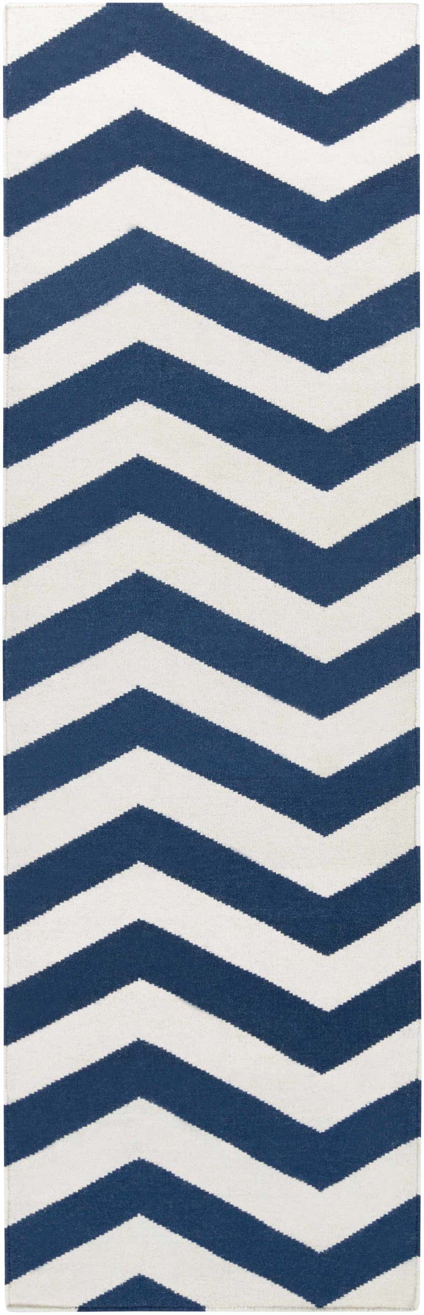 Close-up of the hand woven Tamaya Area Rug. Dark blue and white chevron pattern. 100% wool texture. Design-Runner-268