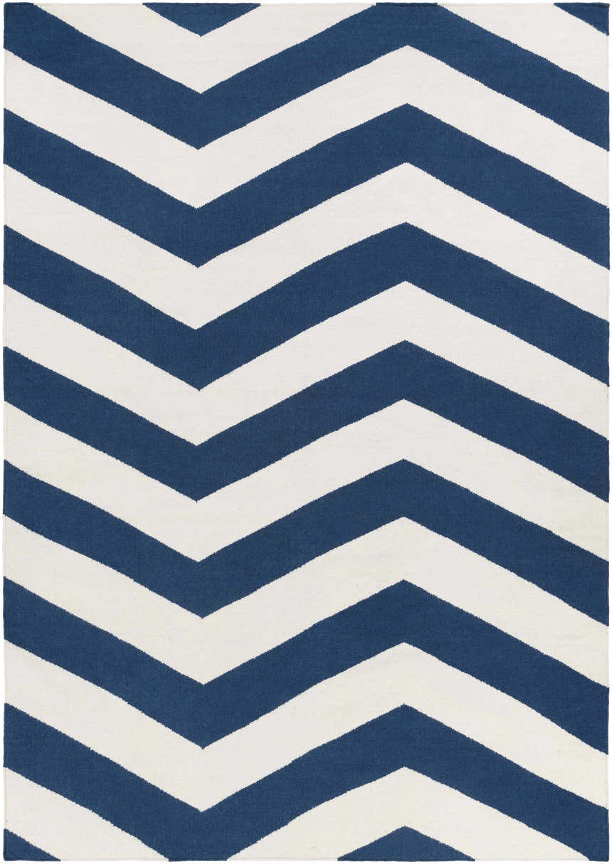 Close-up of the Tamaya Area Rug. Hand-woven wool rug with a bold, dark blue and white chevron pattern. Design-Rectangle-811