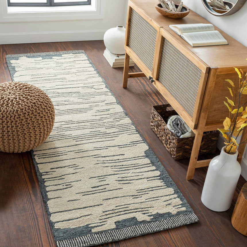 Entryway with a Tapas Wool Area Rug runner in cream and charcoal, wood floors, and a console table. Roomscene-Runner