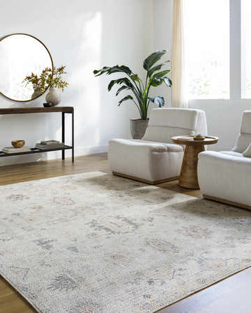 Living room scene with the Trina Area Rug, light gray chairs, wood floors, and modern decor. Roomscene-Rectangle