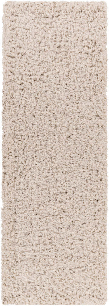 Close-up of a Siari Solid Oatmeal Shag Rug showing its texture, color, and shag design. Design-Runner-2773