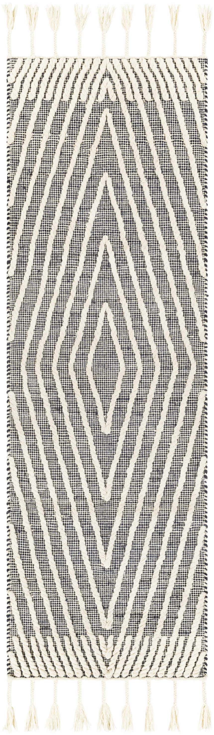 Close-up of a Tamayong Tasseled Jute & Wool Rug. Black rug with cream diamond pattern and tassels. Bohemian style. Design-Runner-268