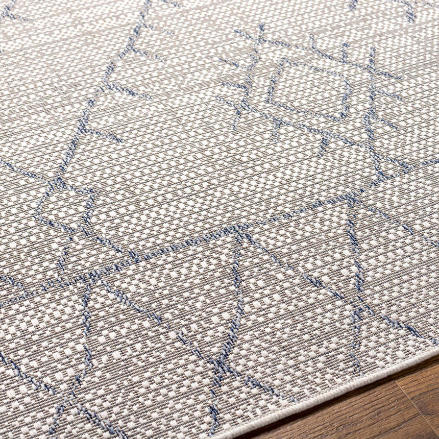 Close-up of the Marwood Gray&Blue Nordic Rug, featuring a geometric pattern and woven texture in gray, blue, and off-white. Texture