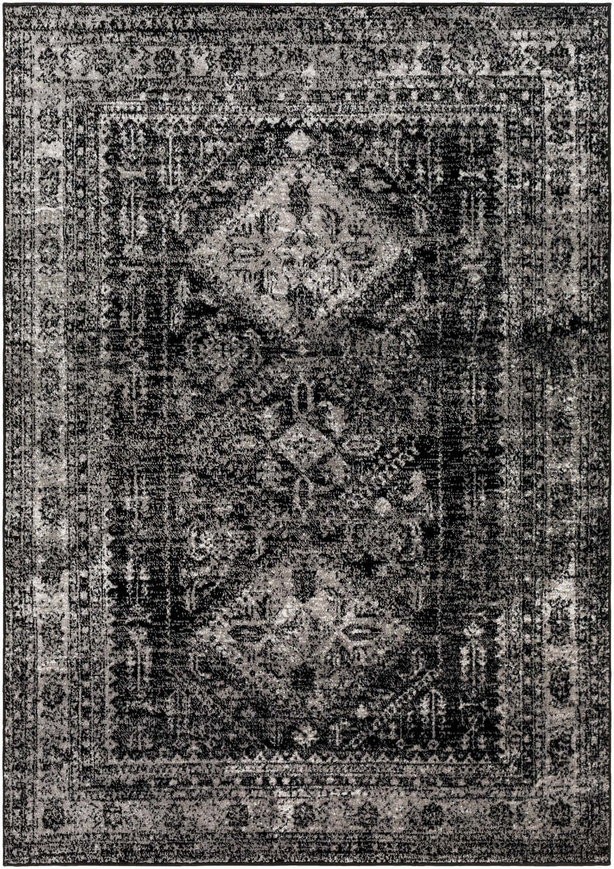Close-up of the Toni Area Rug, a machine-woven rug in black, charcoal, and gray with a traditional, farmhouse-style pattern. Design-Rectangle-5373