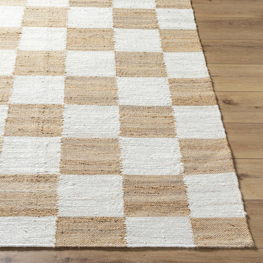 Close-up of the Tyhir Checkered Jute Rug showing light brown and white woven squares on a wood floor. Front