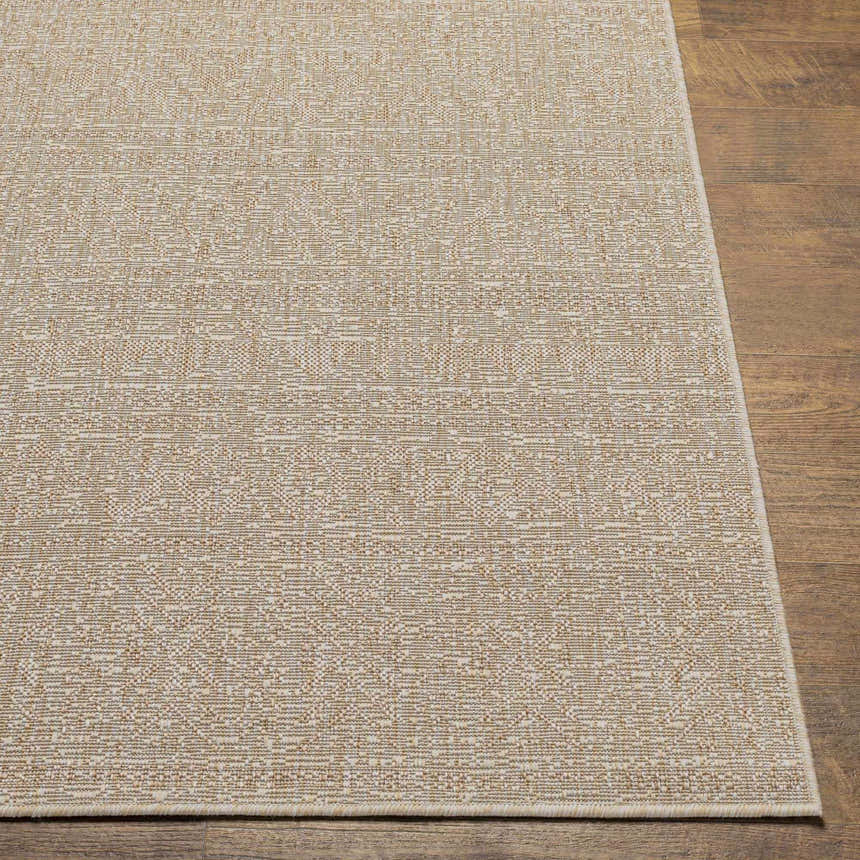 Close-up of the Vanderhoof Indoor & Outdoor Rug. Mocha and light peach tones with a subtle geometric pattern. Front