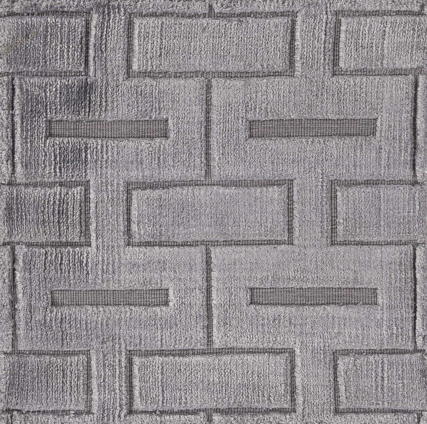 Close-up of the Voca Area Carpet showing a gray, hand-knotted, geometric brick pattern and soft viscose texture. Swatch