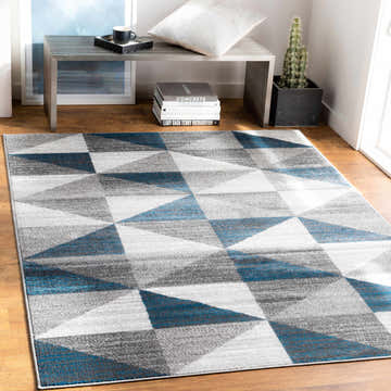 Modern entryway with blue and gray Volant Area Rug, wood floors, and minimalist decor. Roomscene-Rectangle