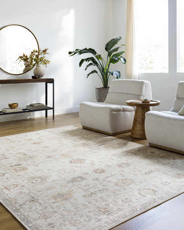 Living room with neutral armchairs and Verna Area Rug in dark brown, dusty coral, gray, ivory, peach, and sage. Roomscene-Rectangle