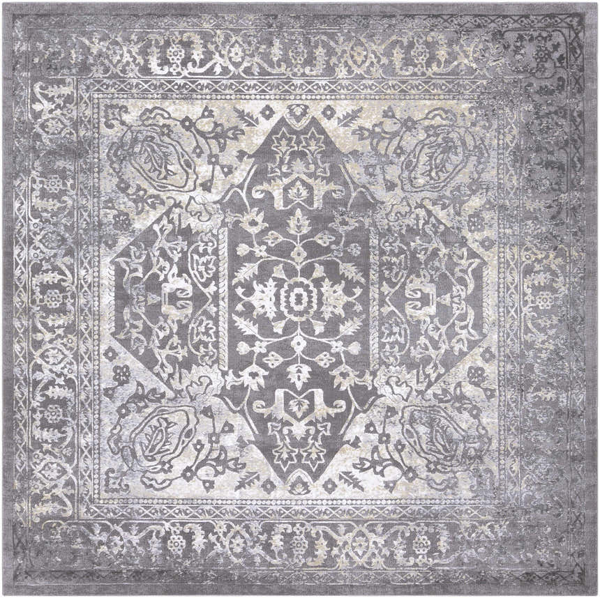 Close-up of the Watford Updated Traditional Tibetan Rug. Charcoal, gray, ivory, and tan vintage-style rug with floral and geometric patterns. Design-Square-710