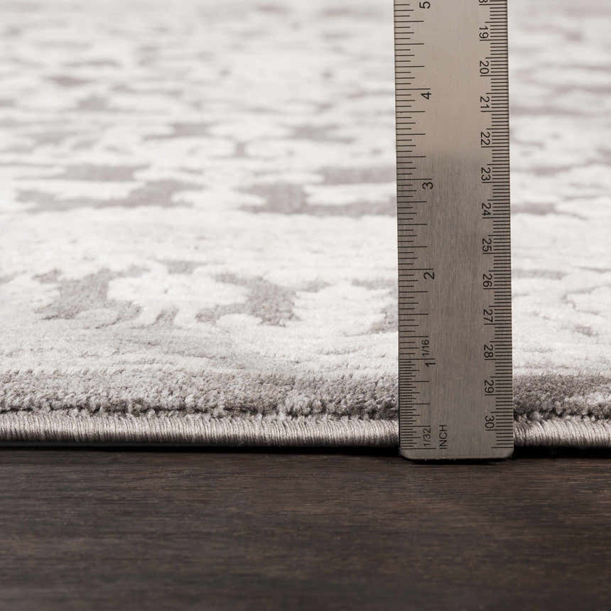 Close up of the pile height of the Watford Updated Traditional Tibetan Rug. Charcoal, gray, and ivory tones. Pile
