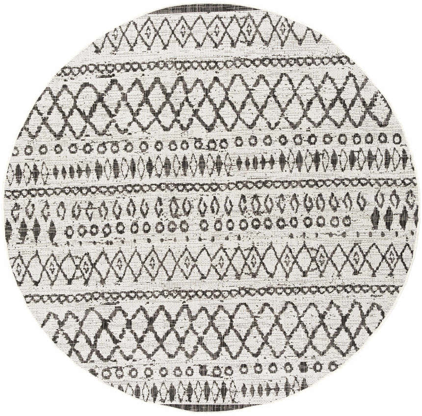 Close-up of the round Westside Outdoor Area Rug. Black and white bohemian pattern. Machine woven polypropylene rug. Design-Round-67