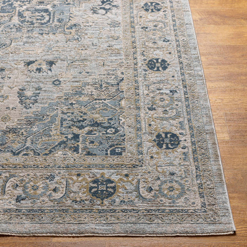 Close-up of the Whangamata Thick Luxe Boutique Rug, showcasing its traditional, light gray, blue, and taupe pattern. Front