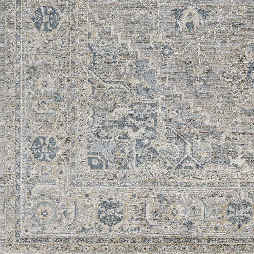 Close-up of the Whangamata Thick Luxe Boutique Rug, showcasing its traditional, light gray, pale blue, and taupe pattern. Swatch
