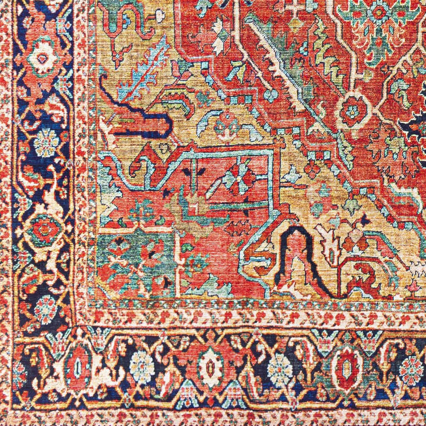Close-up of the Whittingham Area Rug showing the brick red, cream, and blue oriental-inspired pattern and texture. Swatch