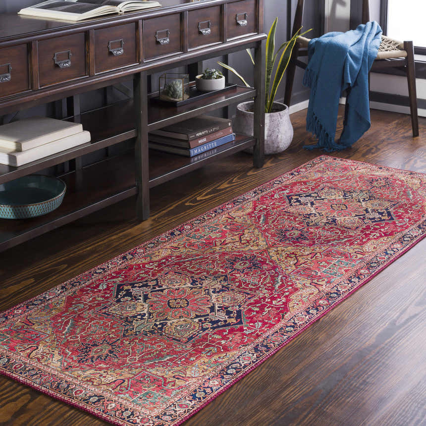Hallway scene with a brick red Whittingham Area Rug, dark wood console table, and blue throw blanket for a cozy, traditional look. Roomscene-Runner
