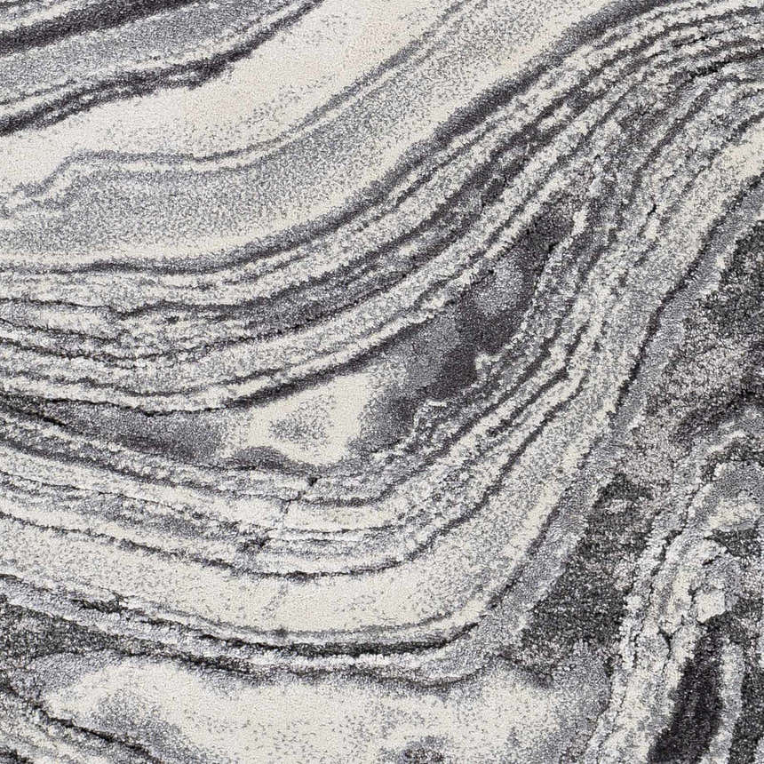 Close-up of the Walloon Gray Marble Thick Rug, showing its charcoal, gray, and ivory swirling pattern and plush texture. Swatch