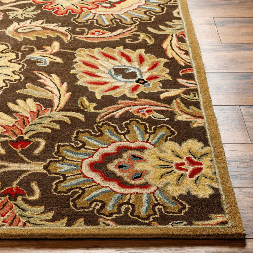 Close-up of the hand-tufted Chesterton 1028 brown wool rug with a traditional floral pattern in brick red, sage, and light beige. Front
