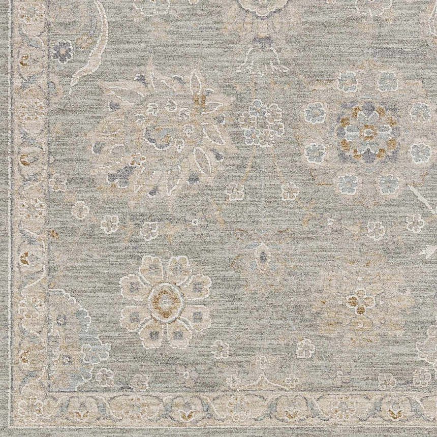 Close-up of the Wurtulla Thick Luxe Statement Rug. Features a vintage floral pattern in dusty sage, beige, brown, and gray tones. Swatch