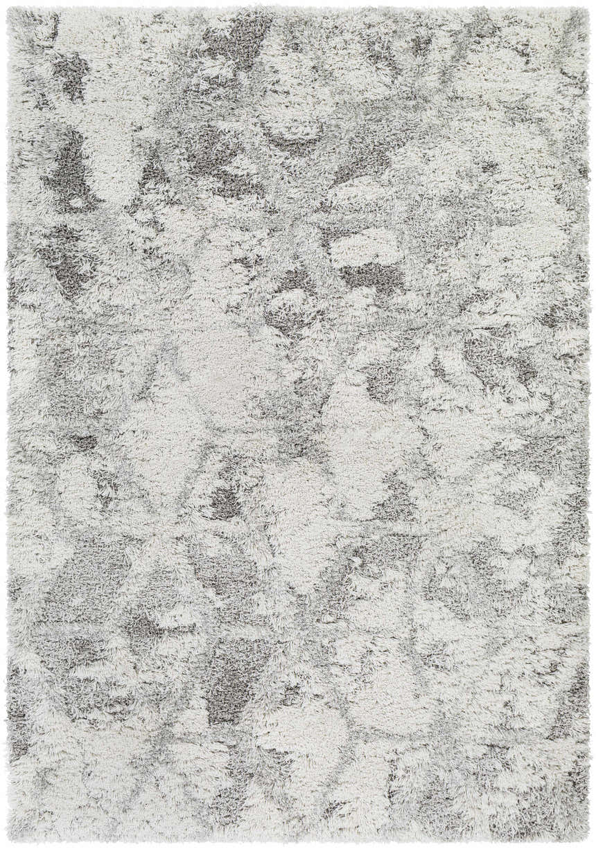 Close-up of the Wynant Gray Tones Plush Rug. Soft, shag texture with light gray, medium gray, and off-white colors. Design-Rectangle-537