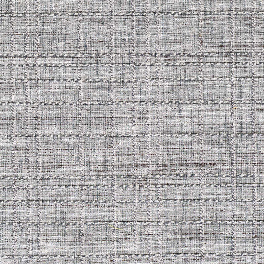 Close-up of the Yatala Area Rug showing a textured, hand-loomed, ivory and dark brown plaid design. Swatch